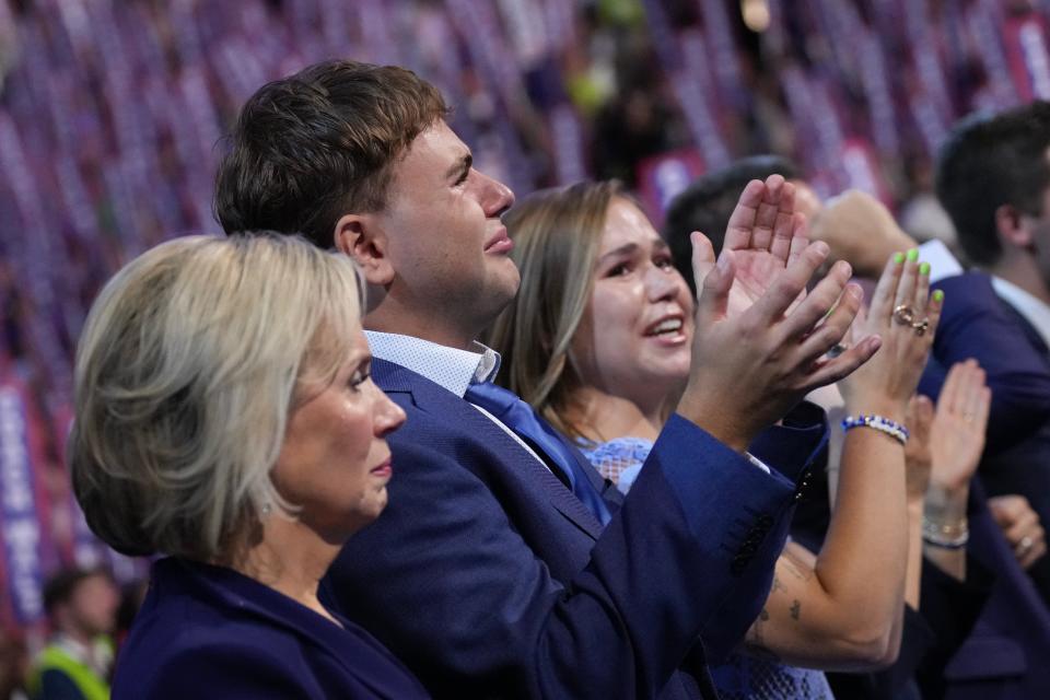 Minnesota First Lady Gwen Walz and her children Gus Walz and Hope Walz listen as Democratic vice presidential candidate Minnesota Governor Tim Walz speaks onstage during the third day of the Democratic National Convention at the United Center on August 21, 2024 in Chicago, Illinois. Democratic Party delegates, politicians and supporters are in Chicago for the convention, which will culminate with current Vice President Kamala Harris accepting her party's presidential nomination. The DNC takes place August 19-22.