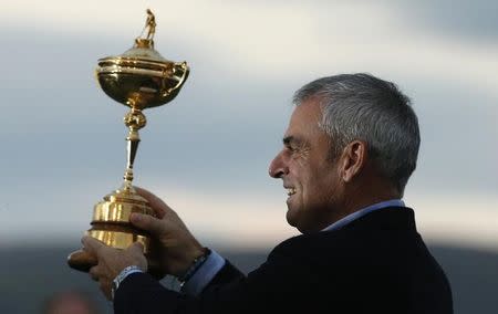 Captain Paul McGinley poses with the Ryder Cup after the closing ceremony of the 40th Ryder Cup at Gleneagles in Scotland September 28, 2014. REUTERS/Phil Noble/Files