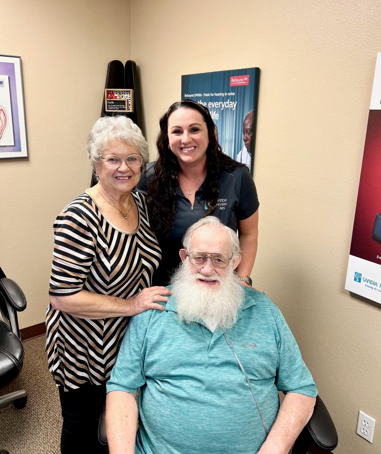 Kristy Tucker, owner and hearing instrument specialist, with Everett Mills and his wife, Barbara Mills, after being fitted with his new Resound, ONE Custom rechargeable hearing aids.