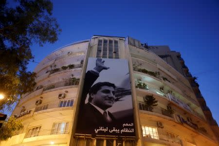 A poster of Lebanese assassinated president-elect Bashir Gemayel, is seen flanked on a building in Beirut,Lebanon October 20,2017.REUTERS/ Mohamed Azakir