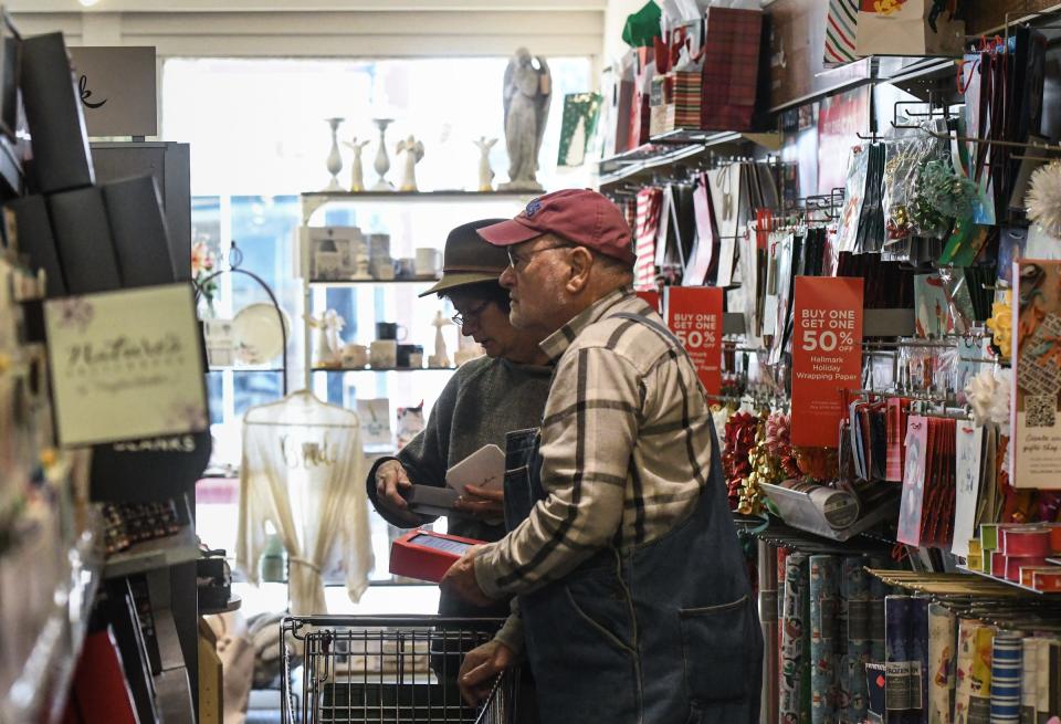 Shoppers peruse Kean's Store Co. in downtown Mason on Wednesday, Dec. 7, 2022.  The old-fashioned variety store has been open for 94 years.