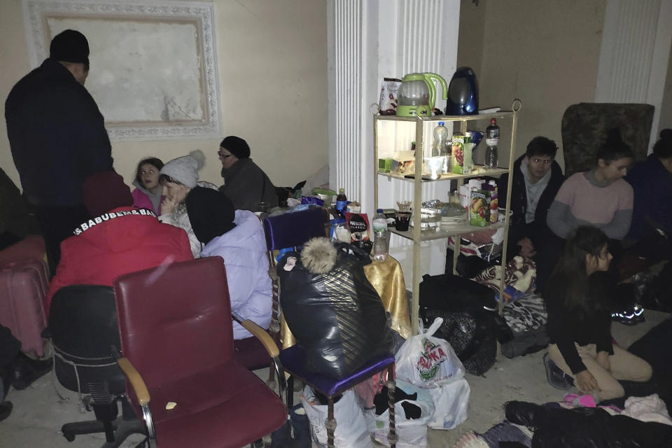 Residents of Mariupol, Ukraine, shelter in the Donetsk Academic Regional Drama Theatre on March 7, 2022, in Mariupol. The March 16, 2022, bombing of the theater stands out as the single deadliest known attack against civilians to date in the war in Ukraine. (Lev Sandalov via AP)