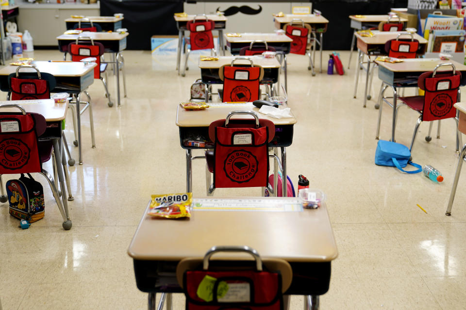 Desks are arranged in a classroom at Panther Valley Elementary School, Thursday, March 11, 2021, in Nesquehoning, Pa. On May 26, 2020, former student, 9-year-old Ava Lerario; her mother, Ashley Belson, and her father, Marc Lerario were found fatally shot inside their home. (AP Photo/Matt Slocum)