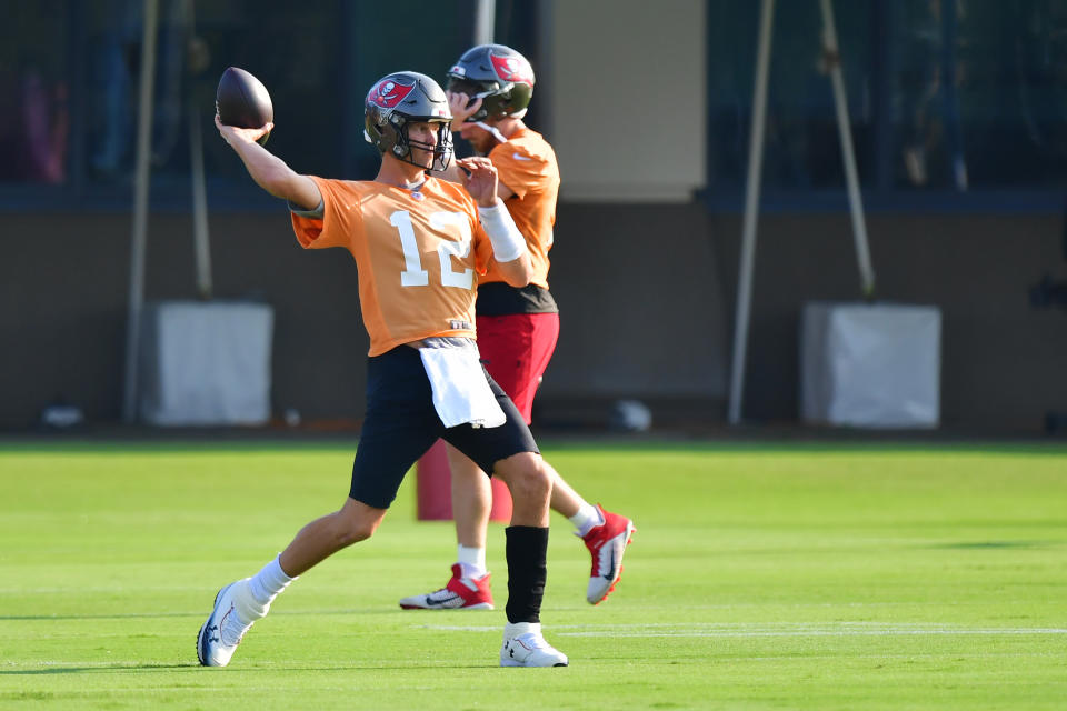 TAMPA, FLORIDA - JULY 25: Tom Brady #12 of the Tampa Bay Buccaneers throws a pass during training camp at AdventHealth Training Center on July 25, 2021 in Tampa, Florida. (Photo by Julio Aguilar/Getty Images)