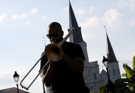 New Orleans musician Tory "Trombone Shorty" Andrews performs in front of the St. Louis Cathedral one day before the ten year anniversary of Hurricane Katrina in New Orleans, Louisiana, August 28, 2015. REUTERS/Jonathan Bachman