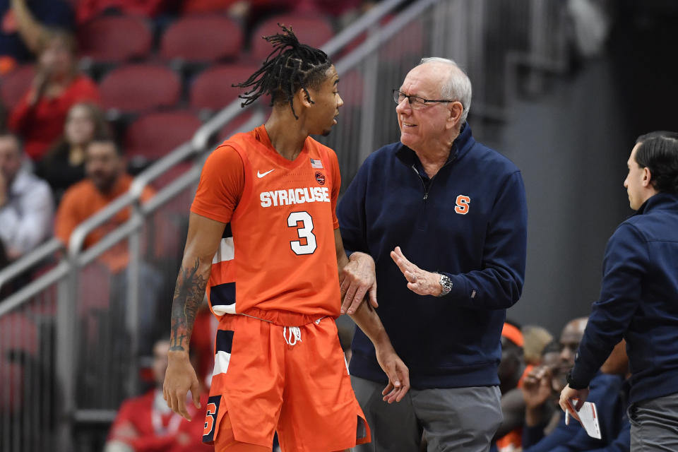 Syracuse head coach Jim Boeheim, right, talks with guard Judah Mintz (3) during the second half of an NCAA college basketball game in Louisville, Ky., Tuesday, Jan. 3, 2023. Syracuse won 70-69. (AP Photo/Timothy D. Easley)