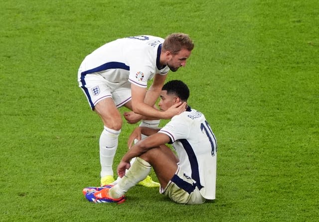 England’s Harry Kane commiserates with Jude Bellingham