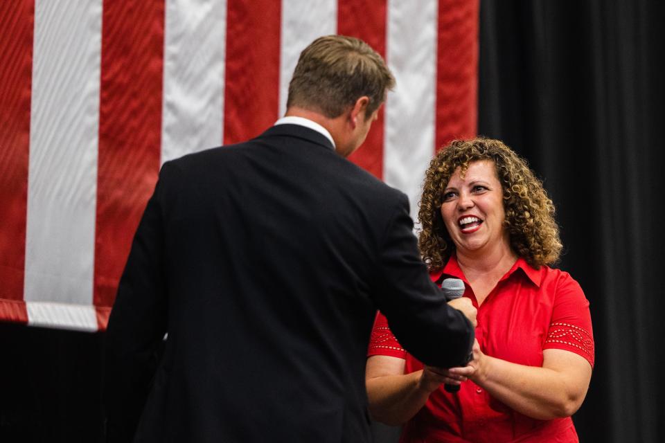 Utah Congressional 2nd District candidate Celeste Maloy shakes the hand of fellow candidate Jordan Hess after Hess endorsed her during the Utah Republican Party’s special election at Delta High School in Delta on June 24, 2023. | Ryan Sun, Deseret News