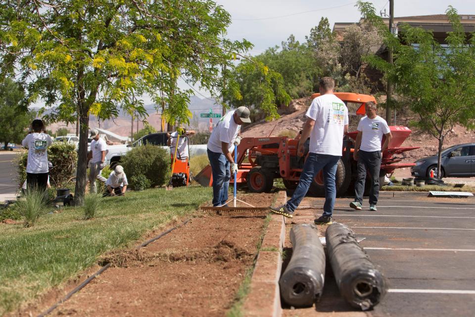 Washington City residents replace grass as part of the statewide landscape conversion event Flip Blitz Thursday, May 19, 2022. 