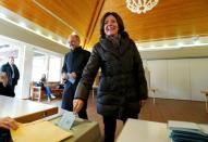 Rhineland-Palatinate federal state premier Malu Dreyer from the Social Democrats (SPD) and her husband Klaus Jensen arrive at a polling station during regional elections in Trier Germany March 13, 2016. REUTERS/Ralph Orlowski