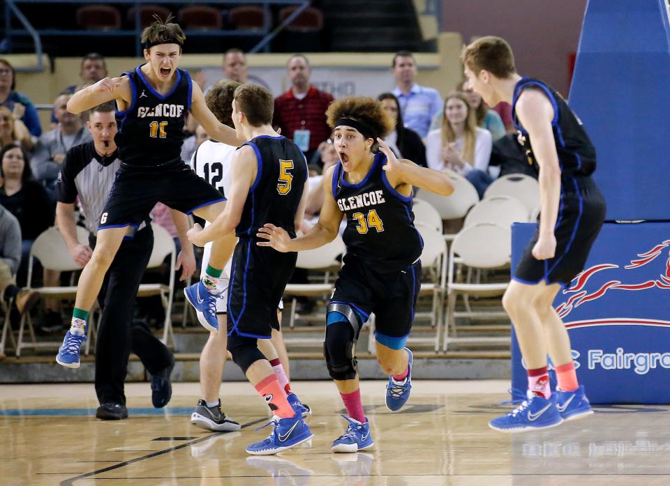 Glencoe celebrates after beating Roff for the Class B boys basketball state championship Saturday at State Fair Arena.