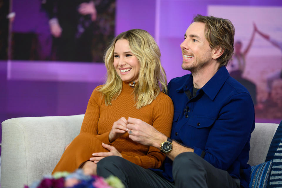 Bell and Shepard sit smiling on a couch on a TV studio set. Bell is in a rust orange turtleneck dress and shepard is in a royal blue shacket. (Nathan Congleton / TODAY)