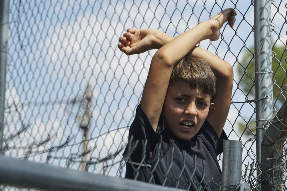 A young refugee boy languishes in the Diavata camp, located in Thessaloniki, Greece, on Aug.&nbsp;17. More than 50,000 refugees are stuck in Greece, waiting either for their asylum claims to be processed or to attempt to travel elsewhere. (Photo: NurPhoto via Getty Images)