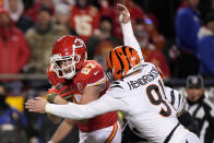 Cincinnati Bengals defensive end Trey Hendrickson (91) hits Kansas City Chiefs tight end Travis Kelce (87) during the first half of the NFL AFC Championship playoff football game, Sunday, Jan. 29, 2023, in Kansas City, Mo. (AP Photo/Charlie Riedel)