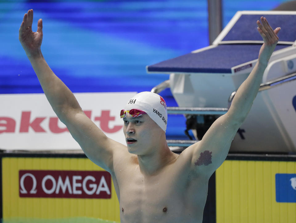 FILE - In this Tuesday, July 23, 2019 file photo, China's Sun Yang celebrates after winning the men's 200m freestyle final at the World Swimming Championships in Gwangju, South Korea. Chinese swimmer star Sun Yang has been banned for more than four years for breaking anti-doping rules. The verdict by the Court of Arbitration for Sport ends Sun’s hopes of defending his Olympic title in the 200 meters freestyle in Tokyo next month. His ban expires in May 2024. (AP Photo/Lee Jin-man, File)
