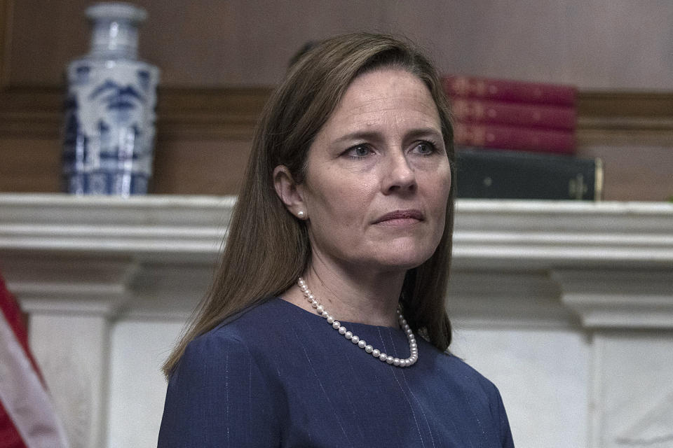 Judge Amy Coney Barrett, President Donald Trump's nominee to the Supreme Court, meets with Sen. Mike Crapo, R-Idaho, not pictured, at the Capitol, Tuesday, Sept. 29, 2020 in Washington. (Tasos Katopodis/Pool via AP)