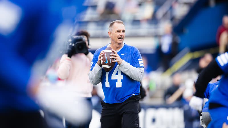 Brigham Young Cougars alumnus Ty Detmer (14) prepares to throw a pass during the Brigham Young University alumni game at LaVell Edwards Stadium in Provo on March 31, 2023.