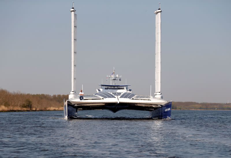 FILE PHOTO: The Energy Observer, a hydrogen-powered boat, sails from Amsterdam's harbour after testing a new device that allows it to produce fuel from wind, in Amsterdam