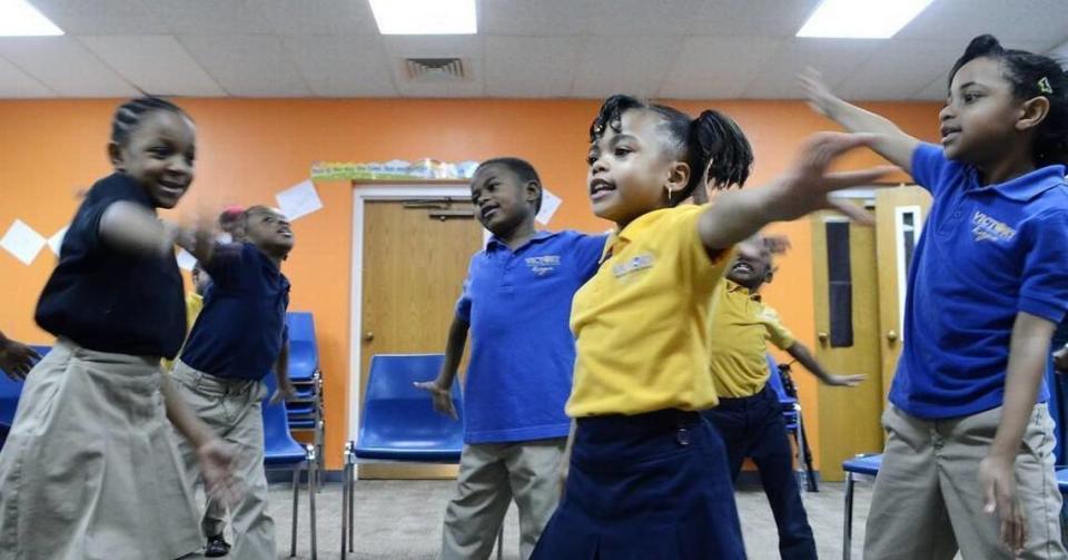 Nariah Hunter (center right), 7, dances with classmates as they sing in music class on March 15, 2016. North Carolina’s Opportunity Scholarship program is making it possible for Janet Nunn’s 7-year-old granddaughter, Nariah Hunter, to attend Victory Christian Center School.