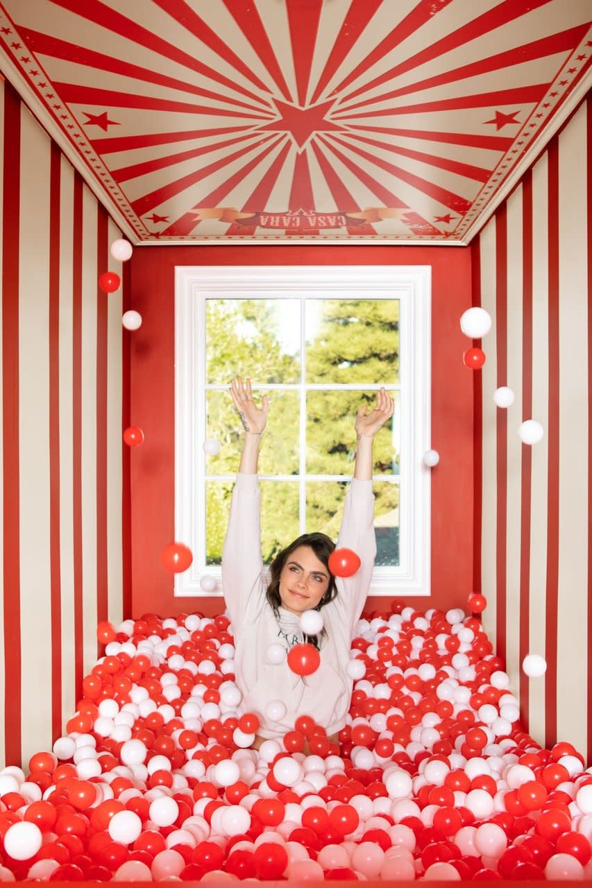 Actor/model Cara Delevingne pops out of a ball pit in her eclectic Los Angeles home. 