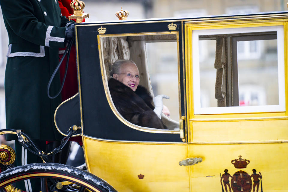 Denmark's Queen Margrethe is escorted by the Hussar Regiment as she rides in a horse-drawn coach from Christian IX's Palace, Amalienborg to Christiansborg Palace in Copenhagen, Denmark, Thursday Jan. 4, 2024. Europe's longest reigning monarch Queen Margrethe rode through Denmark’s capital Thursday in a gilded, horse-drawn coach as she concluded her last New Year celebrations before her abdication later this month. (Emil Nicolai Helms/Ritzau Scanpix via AP)