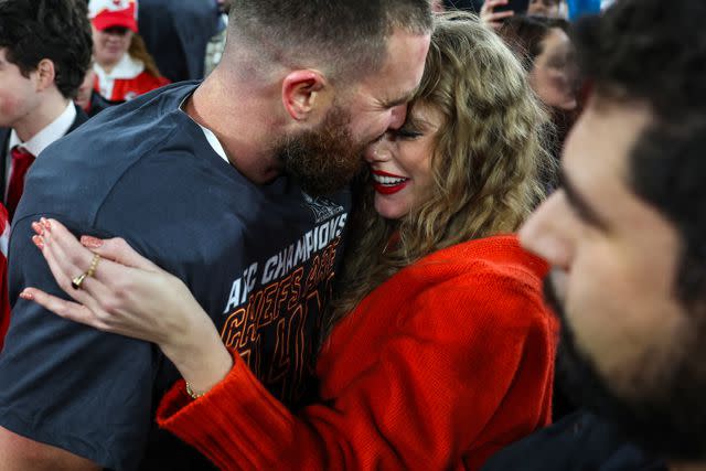 <p>Getty Images</p> Travis Kelce and Taylor Swift cozy up as the Chiefs win game ahead of the Super Bowl