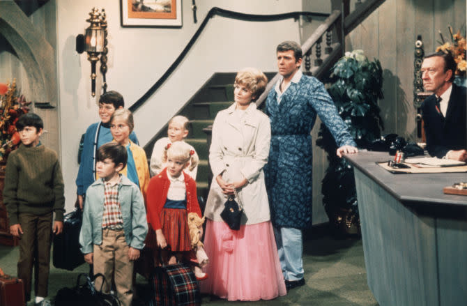 The Brady Bunch family in a hotel