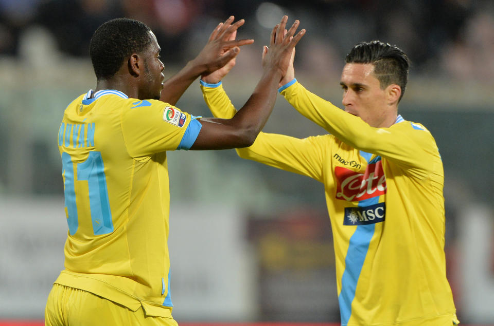 Napoli's Duvan Zapata, left, celebrates with his teammate Jose Maria Callejon after scoring during a Serie A soccer match between Catania and Napoli at the Angelo Massimino stadium in Catania, Italy, Wednesday, March 26, 2014. (AP Photo/Carmelo Imbesi)