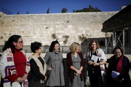 Members of activist group "Women of the Wall" speak to the media following the Israeli government's approval to create a mixed-sex prayer plaza near Jerusalem's Western Wall to accommodate Jews who contest Orthodox curbs on worship by women at the site, in Jerusalem's Old City January 31, 2016. REUTERS/Amir Cohen