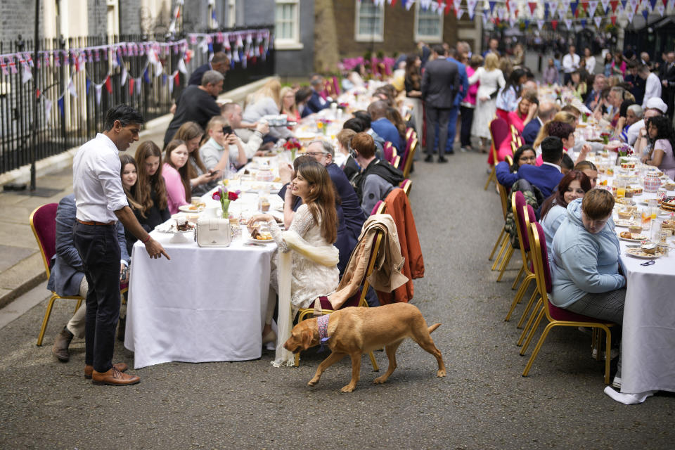 LONDON, ENGLAND - MAY 07: Prime Minister Rishi Sunak beckons his pet dog nova during a lunch in Downing Street to celebrate the coronation of King Charles III and Queen Camilla on May 07, 2023 in London, England. Dignitaries and guests will include the First Lady of the United States of America, Dr. Jill Biden. (Photo by Christopher Furlong/Getty Images)