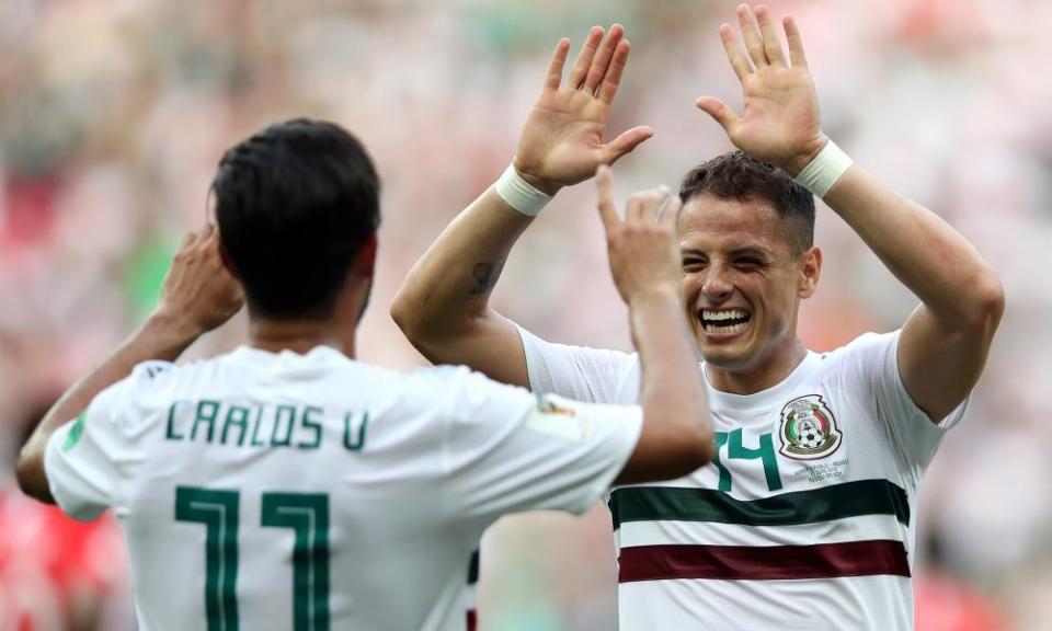 Carlos Vela and Javier Hernández celebrate after Vela gave Mexico the lead from the penalty spot.