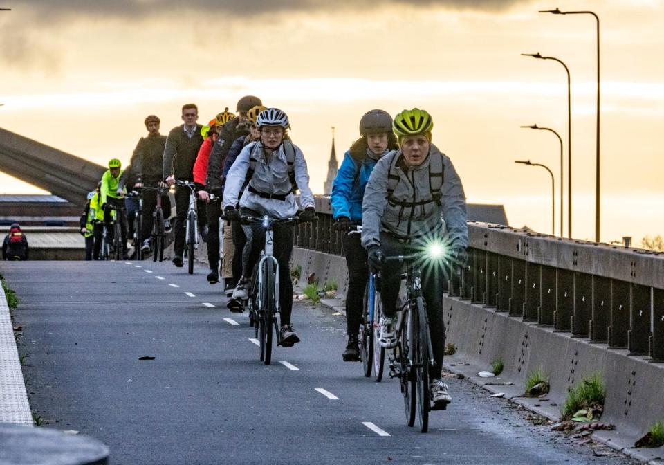 Cyclists beating the strike as they cross the Embankment (Jeremy Selwyn)