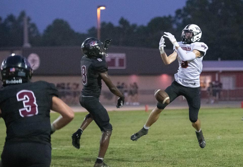 Darius Cunningham (8) breaks up the pass to Josh Spears (3) during the West Florida vs Navarre preseason football game at Navarre High School on Friday, Aug. 18, 2023.