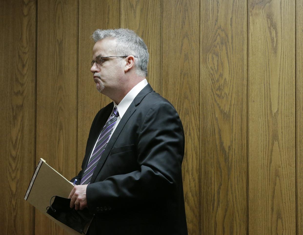Marion County Judge Jason Warner stands to make a statement to the court before he and his wife Julia Warner were sentenced to two years in prison Thursday, April 14, 2021, by Judge Patricia Cosgrove in the Marion County Court of Common Pleas for a June 2020 hit and run that injured a 19-year-old man 2020.Judge Jason Warner was found guilty of complicity to leaving the scene of an accident, a felony of the fourth degree, and complicity to tampering with evidence, a felony of the third degree. Wife Julia Warner, the driver of the vehicle, was found guilty of two counts of misdemeanor negligent assault, complicity to leaving the scene of an accident and complicity to tampering with evidence.