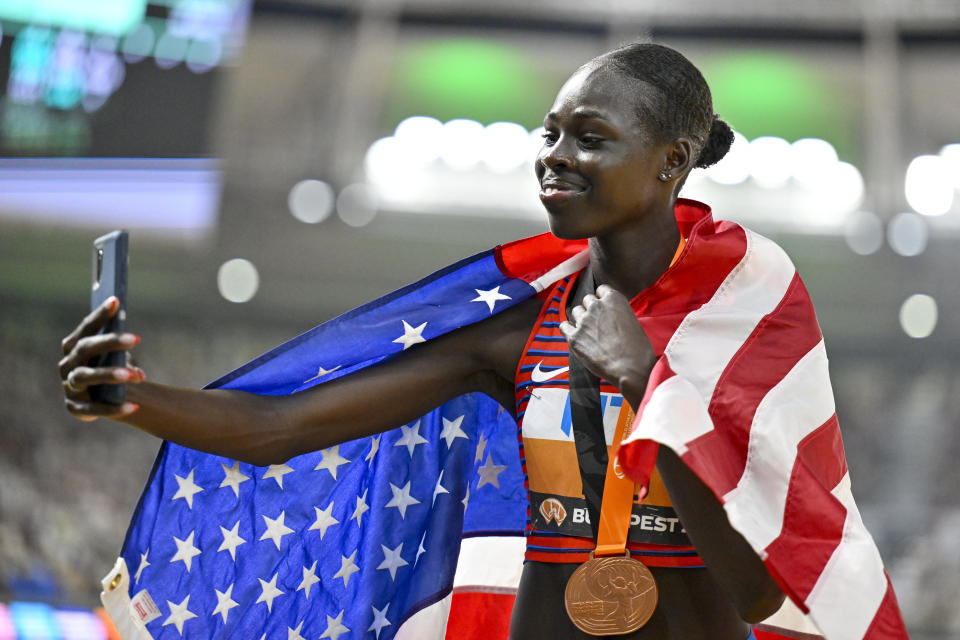 Bronze medalist Athing Mu, of the United States, celebrates after the final of the Women's 800-meters during the World Athletics Championships in Budapest, Hungary, Sunday, Aug. 27, 2023. (AP Photo/Denes Erdos)