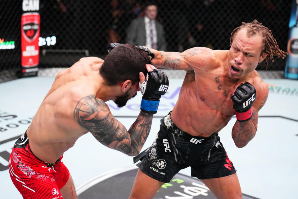 LAS VEGAS, NEVADA – JANUARY 13: (R-L) Marcus McGhee punches Gaston Bolanos of Peru in a bantamweight fight during the UFC Fight Night event at UFC APEX on January 13, 2024 in Las Vegas, Nevada. (Photo by Chris Unger/Zuffa LLC via Getty Images)