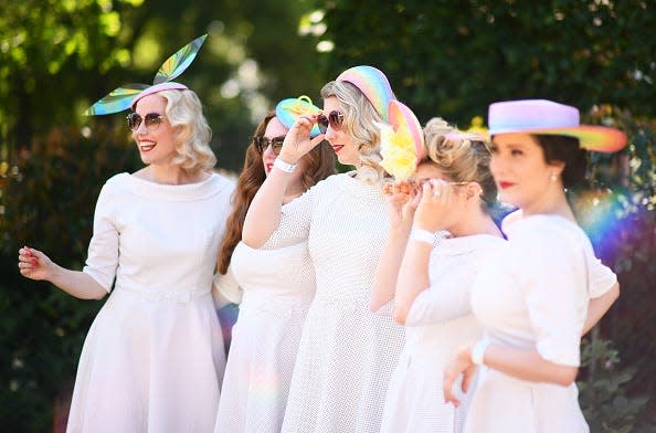 Racegoers pose for a photo on Day Two of the Royal Ascot Meeting at Ascot Racecourse.