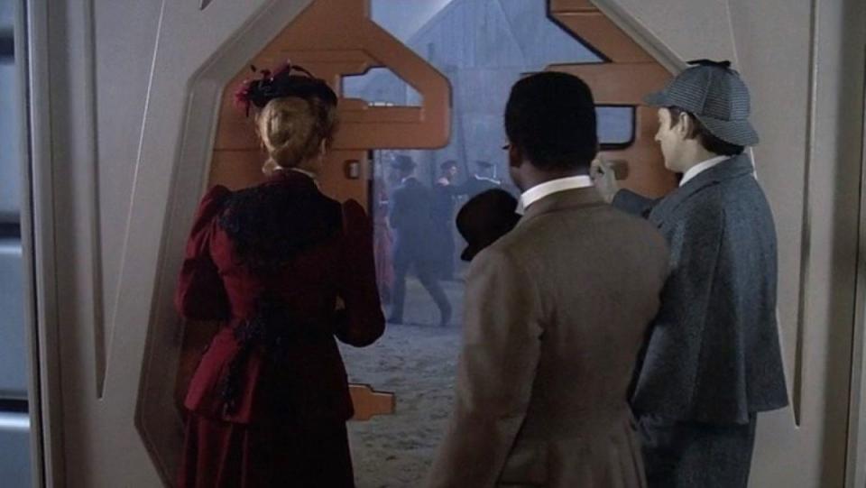 Dr. Pulaski, Geordi, and Data enter the holodeck in Star Trek: The Next Generation