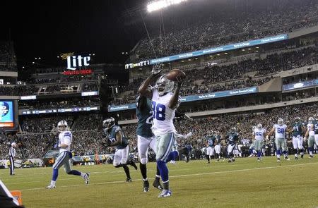 Dallas Cowboys wide receiver Dez Bryant (88) catches a touchdown pass in front of Philadelphia Eagles cornerback Bradley Fletcher (24) in the first quarter at Lincoln Financial Field. Mandatory Credit: Eric Hartline-USA TODAY Sports