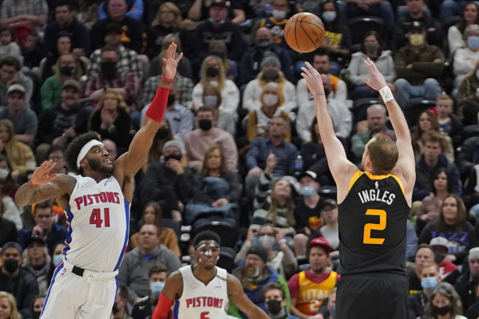 Utah Jazz guard Joe Ingles (2) shoots as Detroit Pistons forward Saddiq Bey (41) defends in the first half during an NBA basketball game Friday, Jan. 21, 2022, in Salt Lake City. (AP Photo/Rick Bowmer)