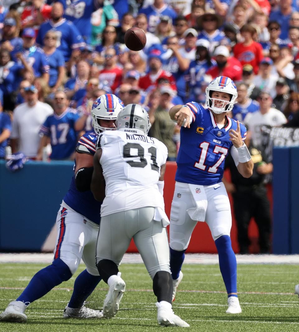 Bills quarterback Josh Allen throws short over the middle.