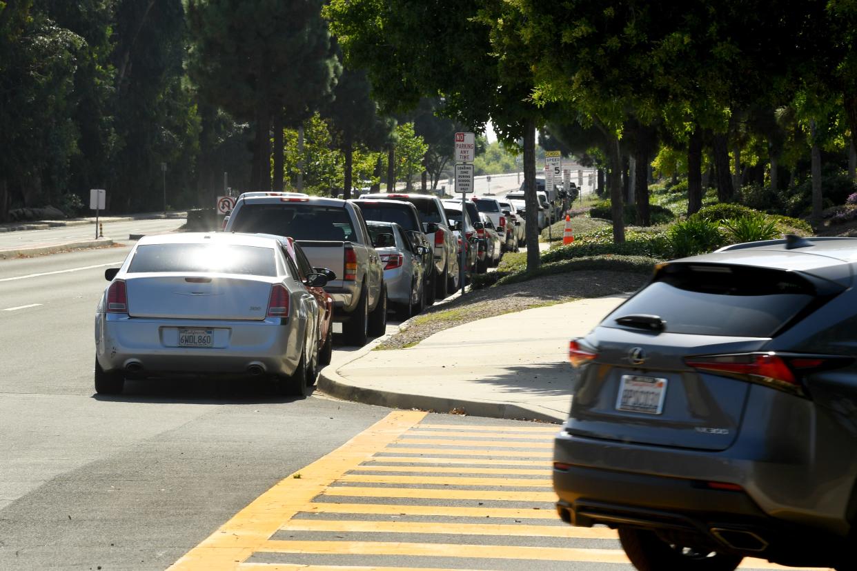 A reader asks: Should I pull over when the line of cars in a funeral procession is on my side and wait for the procession to go by and also pull over when the procession is coming the other way?