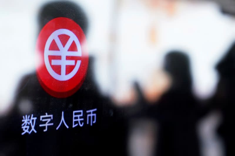 A sign indicating digital yuan, also referred to as e-CNY, is pictured on a vending machine at a subway station in Shanghai, China