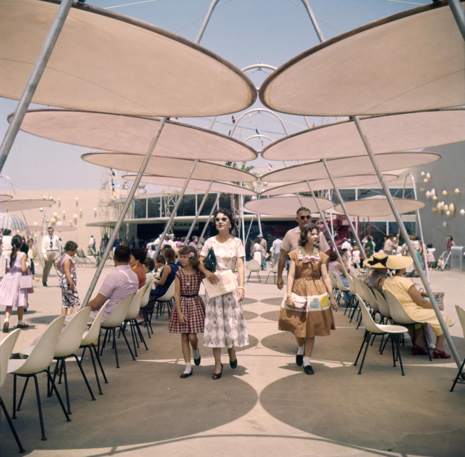 Tourists stroll through Tomorrowland at Disneyland in 1955.