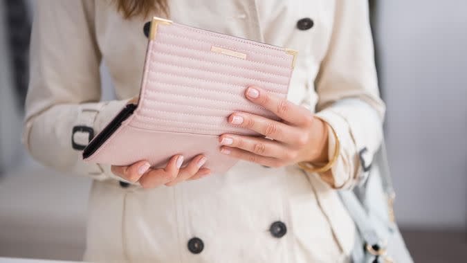 woman opening up her purse wallet