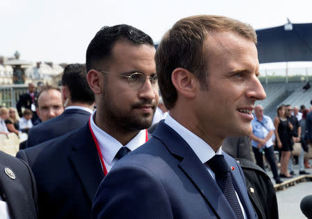 FILE PHOTO: French President Emmanuel Macron walks ahead of his aide Alexandre Benalla at the end of the Bastille Day military parade in Paris, France, July 14, 2018. REUTERS/Philippe Wojazer/Pool