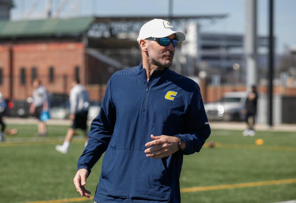 Chattanooga NCAA college football assistant coach Chris Malone looks on during a team practice in Chattanooga, Tenn., in this Tuesday, March 19, 2019, photo. The Chattanooga football assistant coach fired over a social media post disparaging the state of Georgia and voting rights advocate Stacey Abrams is suing to get his job back along with back pay and damages. He contends his First Amendment rights were violated. Malone says he was forced to resign Jan. 7 in the lawsuit filed Tuesday, April 27, 2021, in the Eastern District of U.S. District Court. (Doug Strickland/Chattanooga Times Free Press via AP)