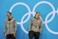 US swimmer Michael Phelps (R) laughs at the podium with silver medalist US swimmer Ryan Lochte (L) after winning the men's 200m individual medley swimming event at the London 2012 Olympic Games in London