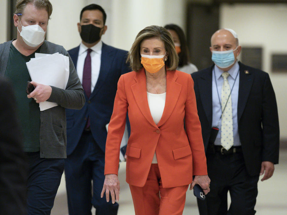 Speaker of the House Nancy Pelosi, D-Calif., arrives for her weekly news conference at the Capitol in Washington, Thursday, March 11, 2021. (AP Photo/J. Scott Applewhite)