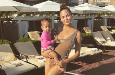 Chrissy Teigen posted an adorable pic of Luna talking on the phone, and the internet has the best captions